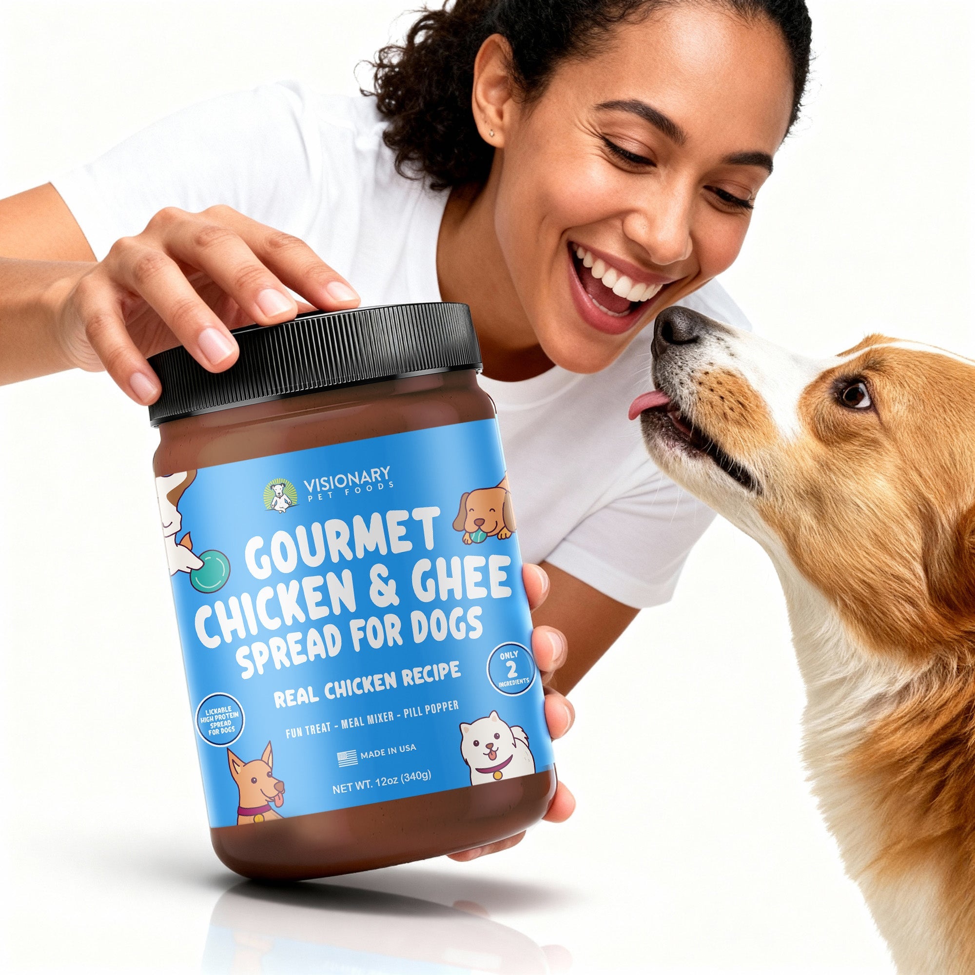 Woman holding a jar of gourmet chicken and ghee spread for dogs with a dog licking her hand.