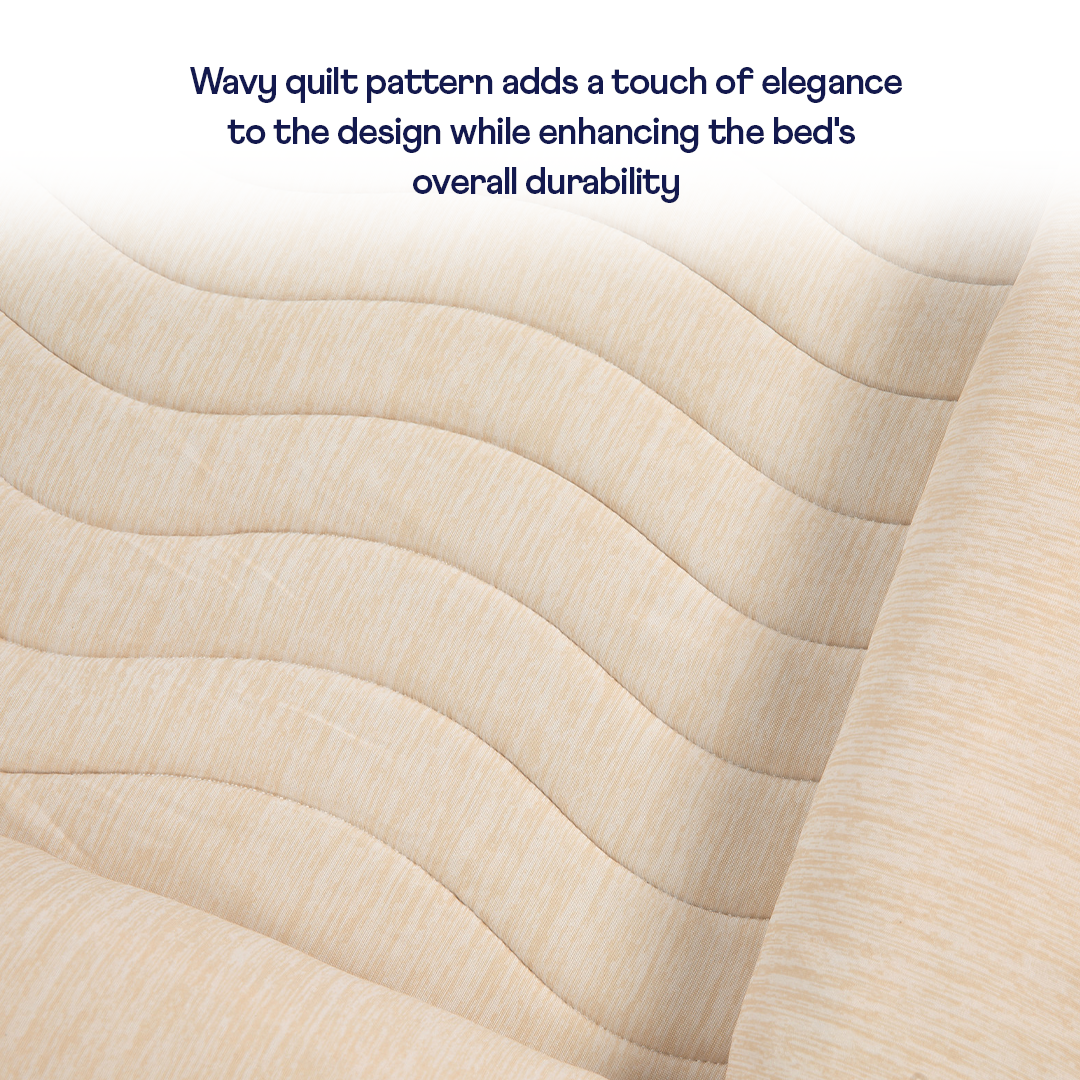 Close-up of a wavy quilt pattern on a bed with text overlay.