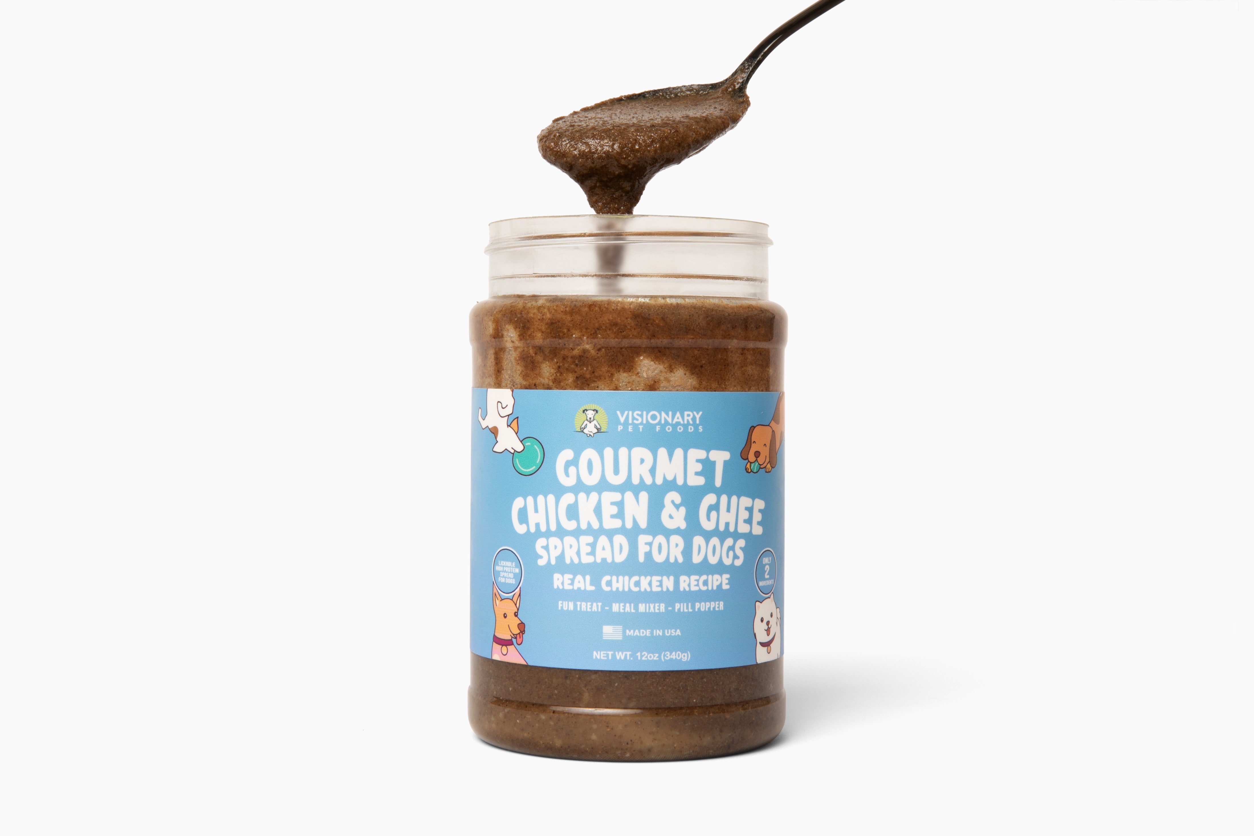 Jar of gourmet chicken and ghee spread for dogs with a spoonful of the spread on a white background.