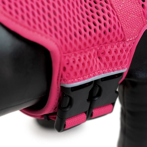 Close-up of a pink mesh seat cover on a motorcycle seat with a white background